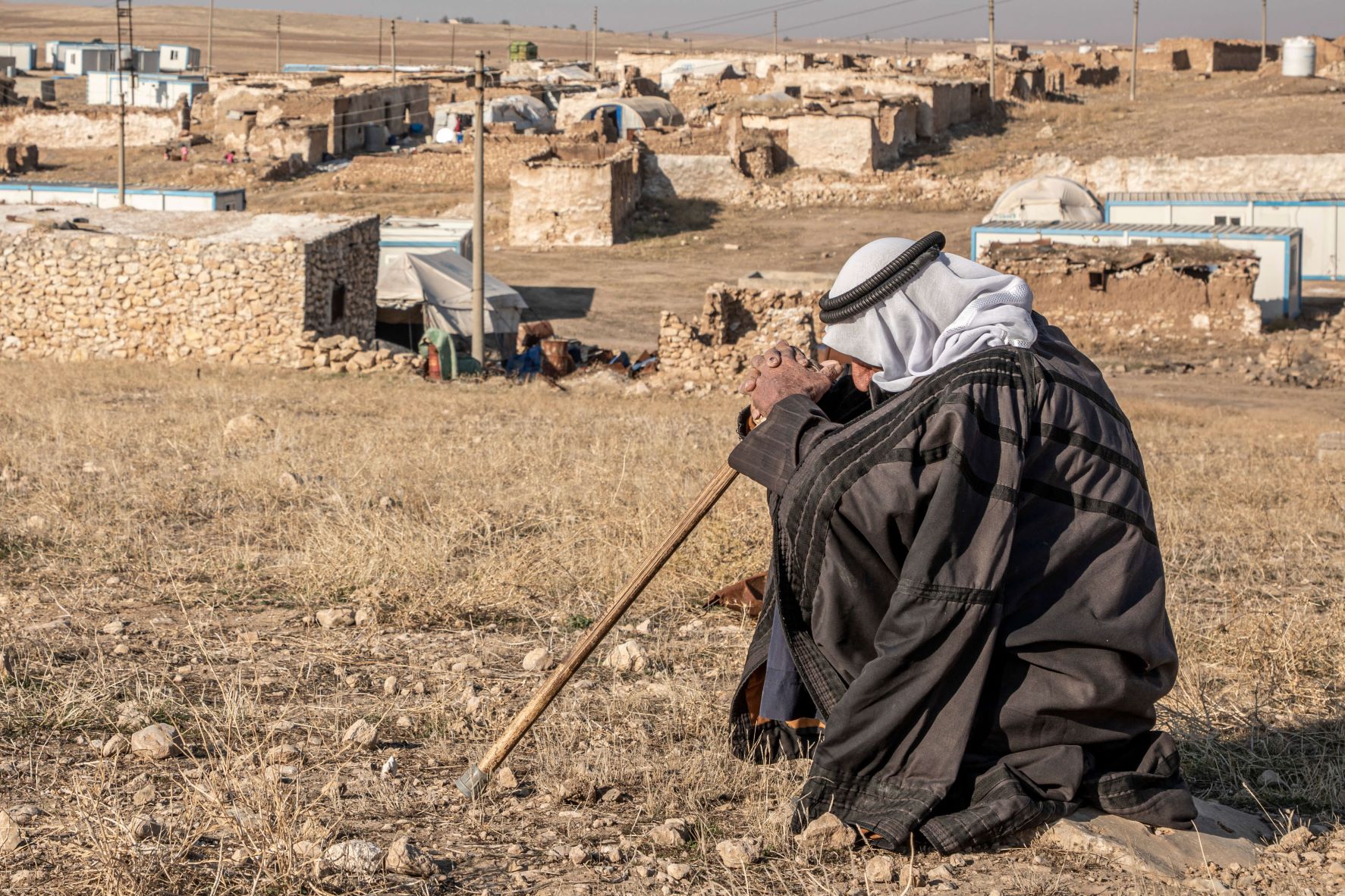 Iraq. A returnee sits near his destroyed home after the camp where he was living was closed. 2020 © UNHCR/Rasheed Hussein Rasheed